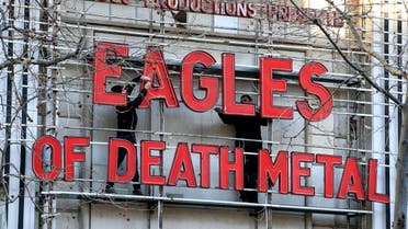 Workers set up ahead a Tuesday's concert by Eagles of Death Metal, at the Olympia music hall, in Paris, Tuesday, Feb. 16, 2016. AP