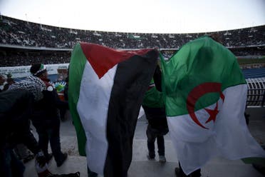 Algerian and Palestinian fans react during a friendly soccer match between the Palestinian and Algerian Olympic football teams at the du 5 Juillet 1962 stadium in Algiers. (Reuters)