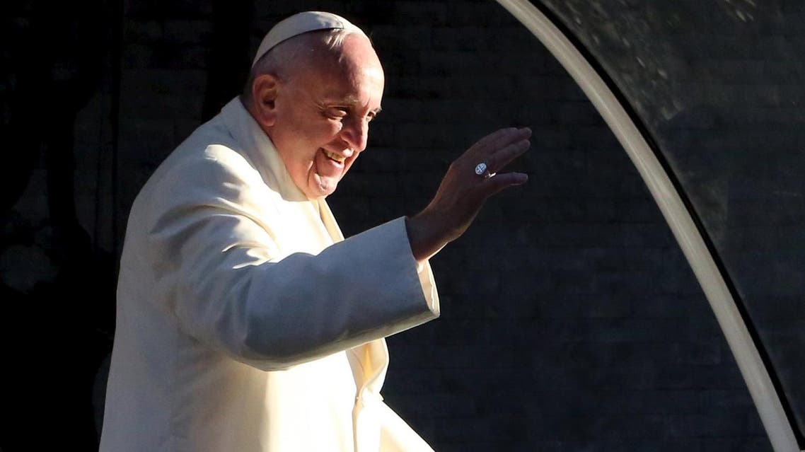 Pope Francis waves to the crowd as he leaves the capital en route to Ciudad Juarez, the last stop of his visit to Mexico, in Mexico City. (Reuters)
