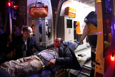 Paramedics carry a wounded man from the site of an explosion into an ambulance in Ankara, Wednesday, Feb. 17, 2016. Assailants on Wednesday exploded a car bomb near vehicles carrying military personnel in the Turkish capital, killing at least 18 people and wounding some 45 others, officials said. (Mustafa Kirazli/Cihan News Agency via AP) 