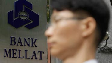 A South Korean man walks by a signboard of the Iranian Bank Mellat Seoul branch in Seoul, South Korea, Wednesday, Sept. 8, 2010. South Korea said Wednesday it will ban unauthorized financial dealings with Iran as part of sanctions to join the U.S-led campaign to tighten restrictions against Tehran over its disputed nuclear enrichment program. South Korea also said it will heavily penalize the Seoul branch of Bank Mellat, one of the 15 blacklisted Iranian banks, for violations of laws on foreign exchange transactions, a government statement said without elaborating on the penalty. (AP Photo/ Lee Jin-man)