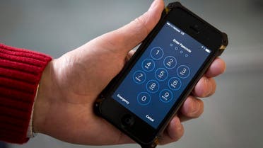 An iPhone is seen in Washington, Wednesday, Feb. 17, 2016. A U.S. magistrate judge has ordered Apple to help the FBI break into a work-issued iPhone used by one of the two gunmen in the mass shooting in San Bernardino, California, a significant legal victory for the Justice Department in an ongoing policy battle between digital privacy and national security. AP