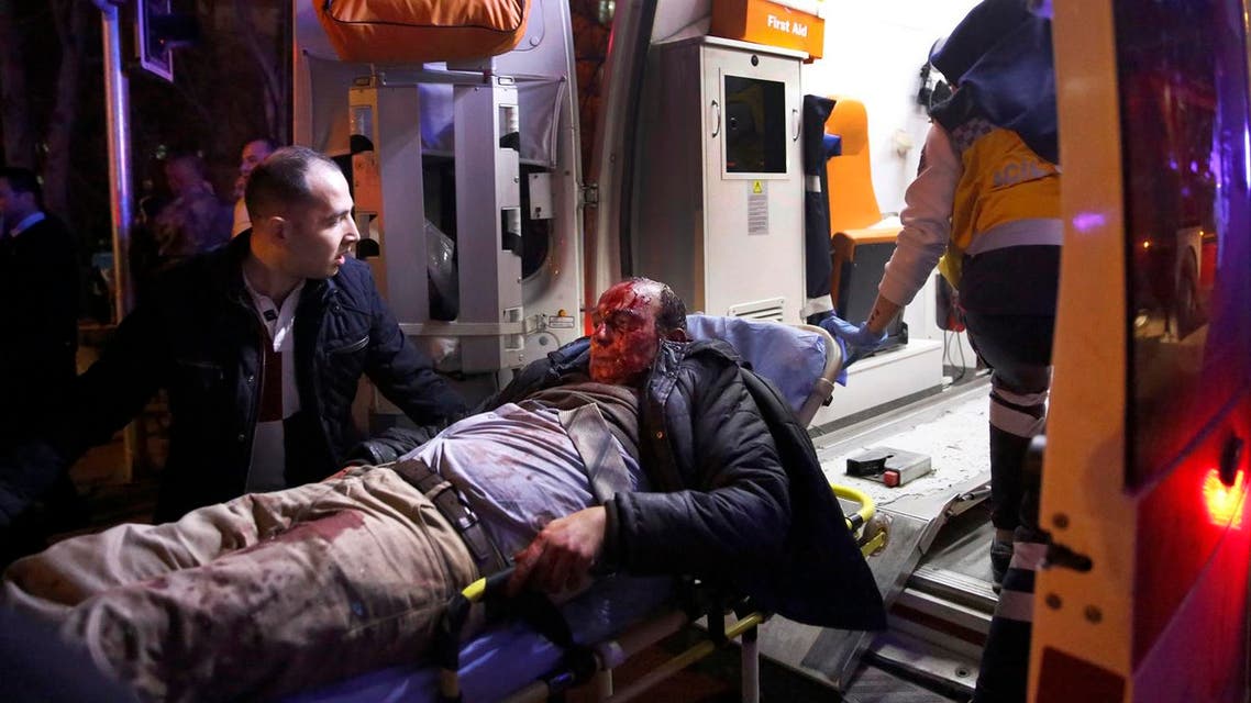 Paramedics carry a wounded man from the site of an explosion into an ambulance in Ankara. (AP)