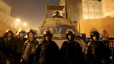 Riot police officers stand guard in front of the Cairo Security Directorate in Egypt. (Reuters)