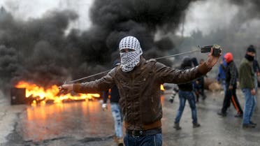 A Palestinian protester prepares his sling to hurl stones towards Israeli troops during clashes in the West Bank town of Qabatya, near Jenin February 6, 2016. On Wednesday, three young Palestinian men from Qabatya wielding guns, knives and pipe-bombs killed a paramilitary Israeli policewoman in Jerusalem and were shot dead. In response, Israeli forces raided the assailants' hometown, arresting five suspected militants and imposing a closure. REUTERS/Mohamad Torokman TPX IMAGES OF THE DAY