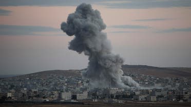 Thick smoke from an airstrike by the US-led coalition rises in Kobani, Syria while fighting continued between Syrian Kurds and the militants of Islamic State group, as seen from Mursitpinar on the outskirts of Suruc, at the Turkey-Syria border, Saturday, Oct. 18, 2014. AP