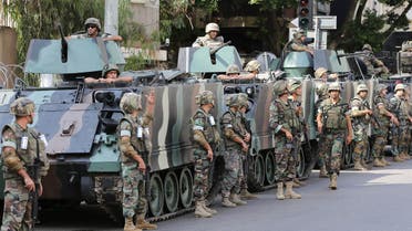 Lebanese army soldiers stand next to their armored personnel carriers, as they guard the building of the Russian embassy, during a sit-in by the Islamic Scholars against Russian intervention in Syria, in Beirut, Lebanon, Wednesday, Oct. 14, 2015.  (AP)