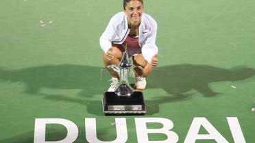 Italy's Sara Errani poses with the trophy after winning her women's singles tennis final match against Czech Republic's Barbora Strycova at the WTA Dubai Tennis Championships February 20, 2016 (Reuters)