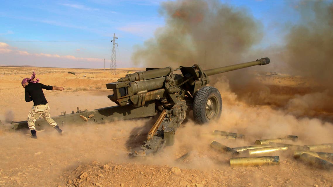 In this photo taken on Saturday, Jan. 30, 2016, Syrian government troops fire at Islamic State group positions near Mahin, Syria.