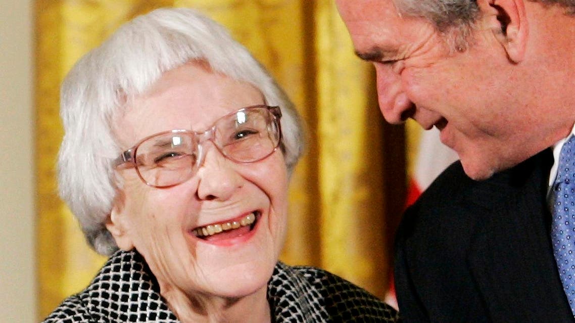 U.S. President George W. Bush (R) before awarding the Presidential Medal of Freedom to American novelist Harper Lee (L) in the East Room of the White House, in this November 5, 2007, file photo. Reuters