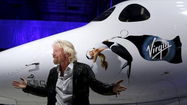 Richard Branson poses after unveiling the new SpaceShipTwo, a six-passenger two-pilot vehicle meant to ferry people into space that replaces a rocket destroyed during a test flight in October 2014, in Mojave. (Reuters)