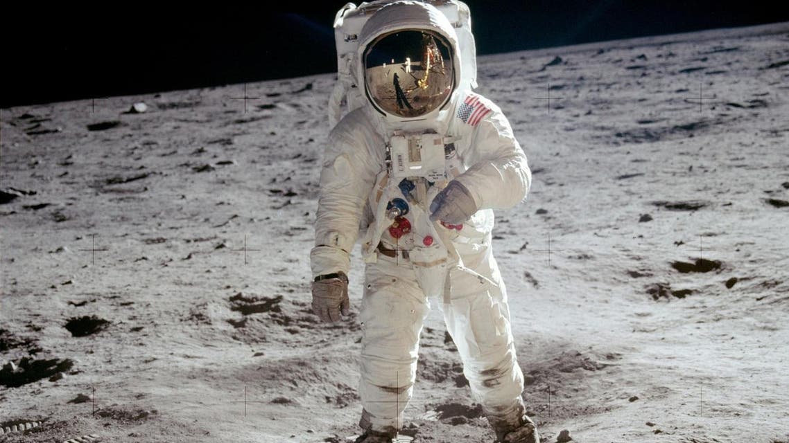 The reflections of Astronaut Neil Armstrong, the U.S. Flag, the Lunar Module and television camera, are reflected in the face mask of Astronaut Edwin "Buzz" Aldrin when his picture was taken by Armstrong as they walked across the surface of the moon, July 31, 1969. AP