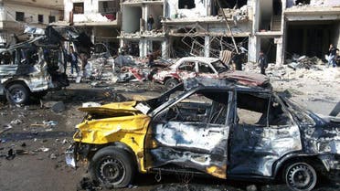 In this photo released by the Syrian official news agency SANA, Syrian citizens gather at the scene where two blasts exploded in the pro-government neighborhood of Zahraa, in Homs province, Syria, Sunday, Feb. 21, 2016. AP