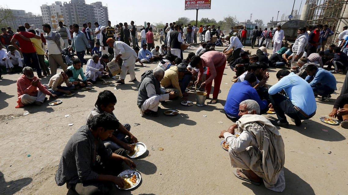 Demonstrators from the Jat community eat as they block the Delhi-Haryana national highway during a protest in New Delhi, India, February 21, 2016. Reuters