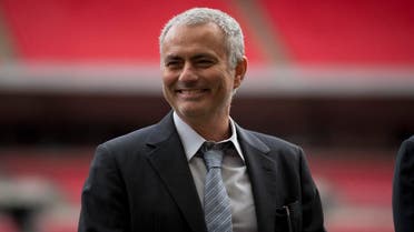Former Chelsea manager Jose Mourinho smiles as he attends a group photo session pitchside as a guest of FIFA Presidential Candidate Gianni Infantino after unveiling his 90 day plan that he will implement if he is elected FIFA President, at Wembley Stadium in London, Monday, Feb. 1, 2016. AP