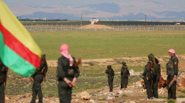 Kurdish members of the Self-Defense Forces stand near the Syrian-Turkish border in the Syrian city of al-Derbasiyah during a protest against the operations launched in Turkey by government security forces against the Kurds, February 9, 2016. REUTERS