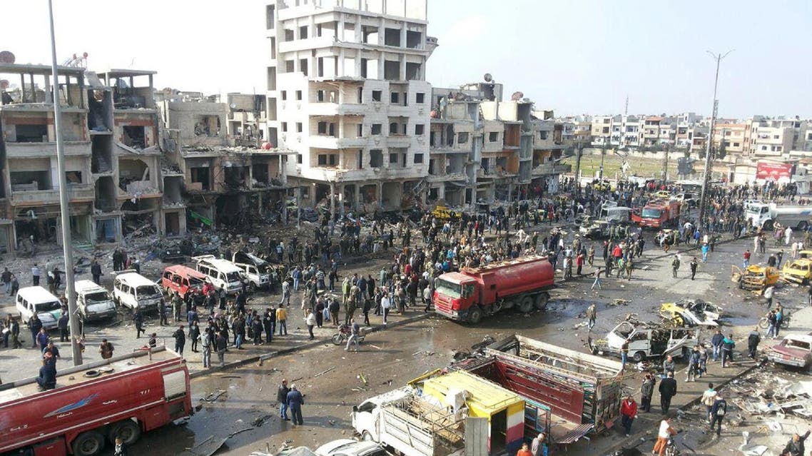 A general view shows the site of a two bomb blasts in the government-controlled city of Homs, Syria, in this handout picture provided by SANA on February 21, 2016. REUTERS
