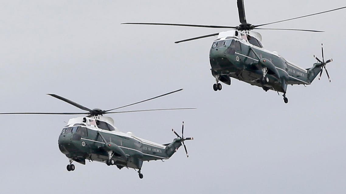 Two Sikorsky VH-3D Sea King helicopters with Marine Helicopter Squadron One (HMX-1) arrive at Miami International Airport for a presidential visit, Wednesday, April 22, 2015, in Miami. (AP)