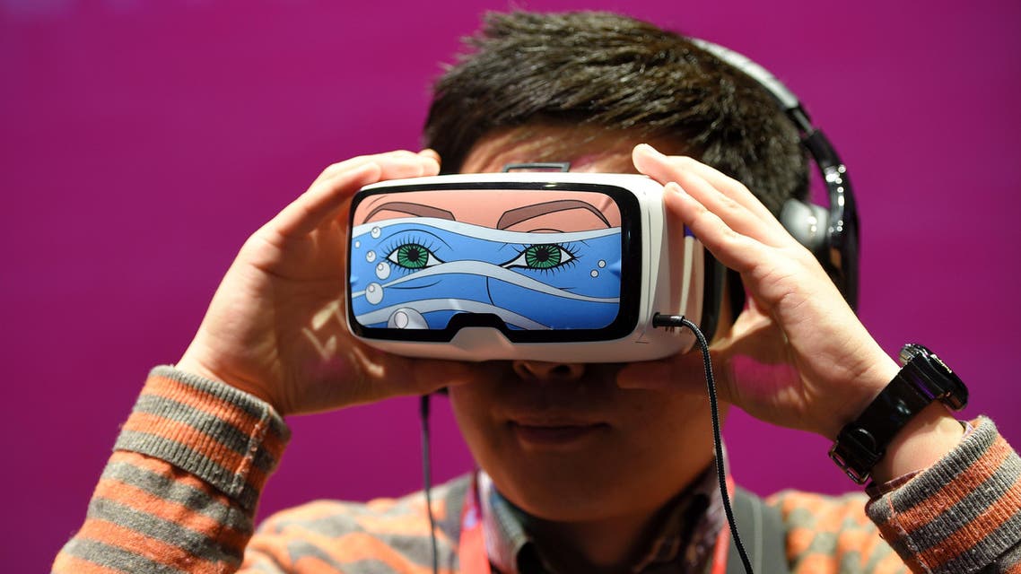 A boy tests the 'Oculus VR' virtual device, at the Deutsche Telekom stand. (AFP)