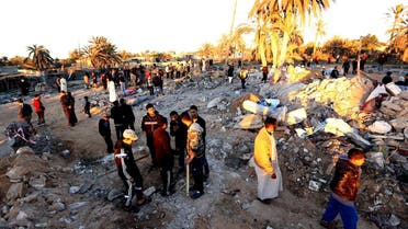 Libyans gather next to debris at the site of a jihadist training camp, targeted in a US air strike, near the Libyan city of Sabratha. (AFP)