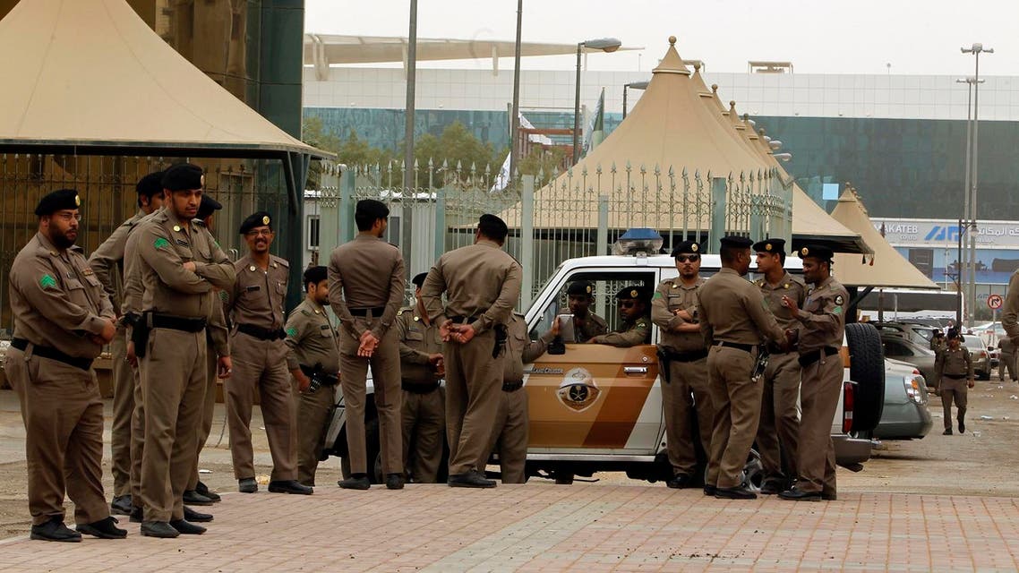 Policemen stand by on a main street in Riyadh March 11, 2011. Police flooded the streets of the Saudi capital on Friday looking to deter a planned day of demonstrations and small protests were reported in the east of the oil-rich country that has been rattled by pan-Arab unrest. REUTERS/Fahad Shadeed (SAUDI ARABIA - Tags: POLITICS CIVIL UNREST RELIGION)