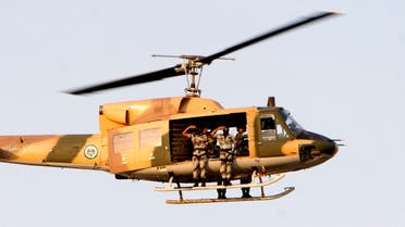 Saudi special forces parade as they fly with a military helicopter during a ceremony as they prepare for the Hajj three days before the event in Arafat 15 kms outside of Mecca, Saudi Arabia, Saturday, Dec. 15, 2007. (AP)