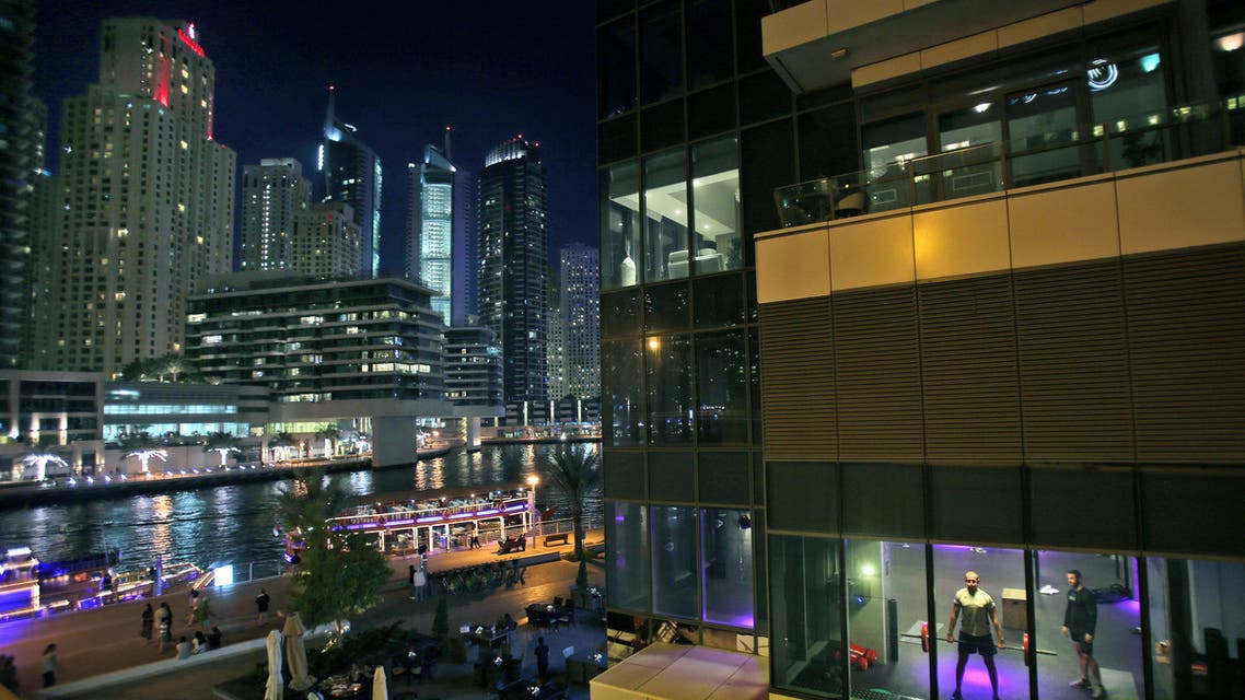 In this March 25, 2015 photo, men work out in a gym along the Marina waterfront in Dubai, United Arab Emirates. (AP)