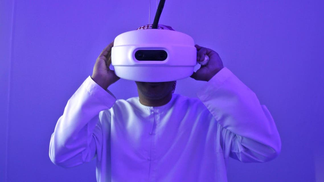 An Emirati man watches through a special viewfinder at the Museum of the future during the opening day of the World Government Summit in Dubai, United Arab Emirates, Monday, Feb. 8, 2016. (AP)