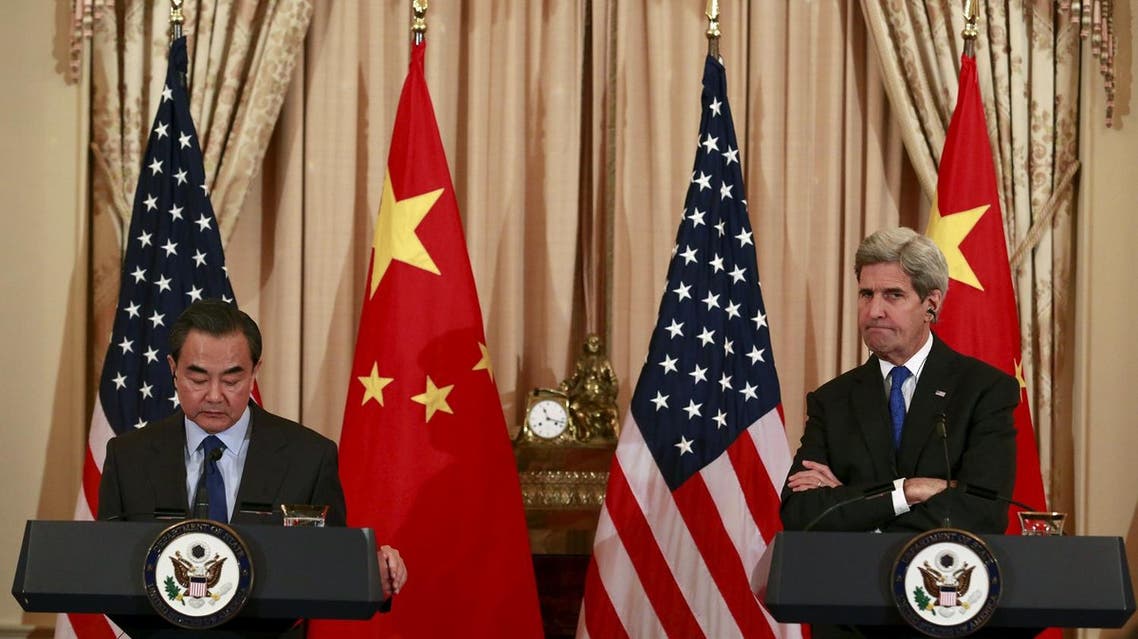 U.S. Secretary of State John Kerry (R) and Chinese Foreign Minister Wang Yi hold a joint news conference after their meeting at the State Department in Washington, February 23, 2016. REUTERS