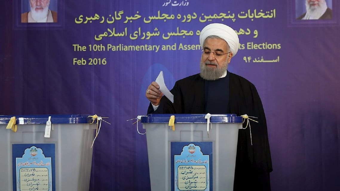 Iranian President Hassan Rowhani casts his vote during elections for the parliament and Assembly of Experts. (Reuters)