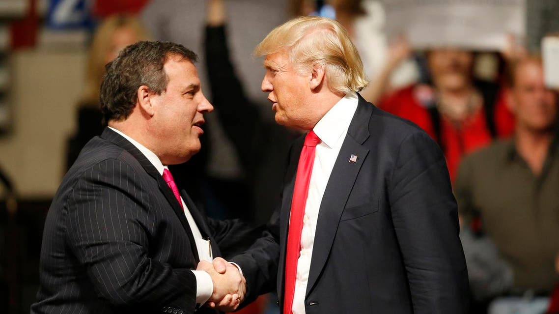 New Jersey Gov. Chris Christie, left, greets Republican presidential candidate Donald Trump, right, at a rally in Oklahoma City, Friday, Feb. 26, 2016. (AP)