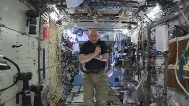 In this image from video made available by NASA, astronaut Scott Kelly speaks to reporters on Earth during a news conference held on the International Space Station on Thursday, Feb. 25, 2016. (AP)