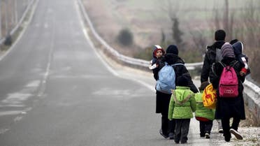 Stranded Afghan migrants make their way towards the Greek-Macedonian border near the Greek village of Idomeni, February 24, 2016 (Reuters)
