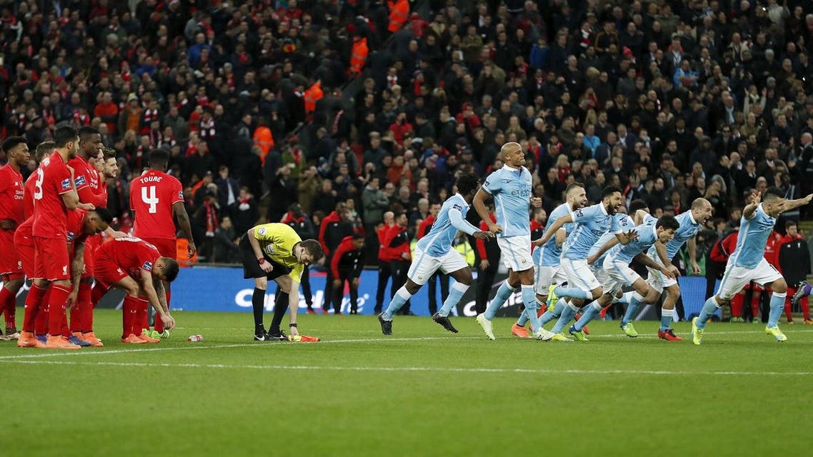 Football Soccer - Liverpool v Manchester City - Capital One Cup Final - Wembley Stadium - 28/2/16Manchester City players celebrate winning the match after a penalty shootout as Liverpool players are dejected Reuters
