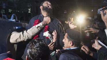 Malik Mumtaz Hussain Qadri, the bodyguard arrested for the killing of Punjab Governor Salman Taseer, shouts religious slogans while being taken away by the police after he was presented at a court in Islamabad, in this January 5, 2011 file picture. (Reuters)