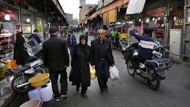 Iranians shop in a market in central Tehran, Iran, Sunday, Feb. 28, 2016. (AP)