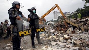 Civil service police watch the demolition of Kalijodo red-light district in Jakarta, Indonesia. (Reuters)