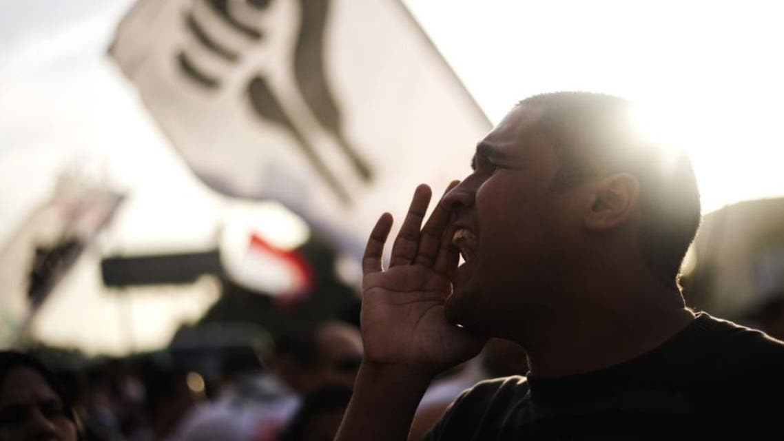 An Egyptian supporter of the April 6 movement shouts slogans against President Mohammed Morsi and the Muslim brotherhood during a march on April 6, 2013. (File photo: AFP)