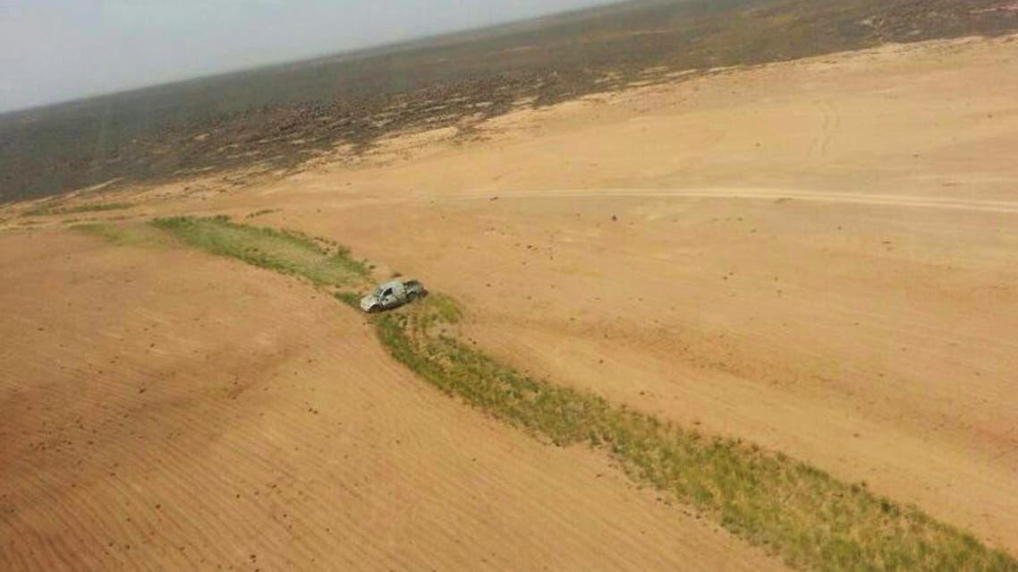This aerial photo shows a truck after a Jordanian air strike on a convoy at the border between Jordan and Syria on Wednesday, April 16, 2014. AP