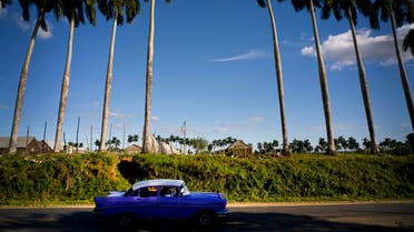 In this February 26, 2016 file photo, a classic American car passes the Francisco Blanco tobacco farm in the province of Pinar del Rio, Cuba. (AP)