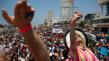 Israeli drag queens perform during the annual Gay Pride Parade on a street of Tel Aviv, Israel, Friday, June 13, 2014. AP