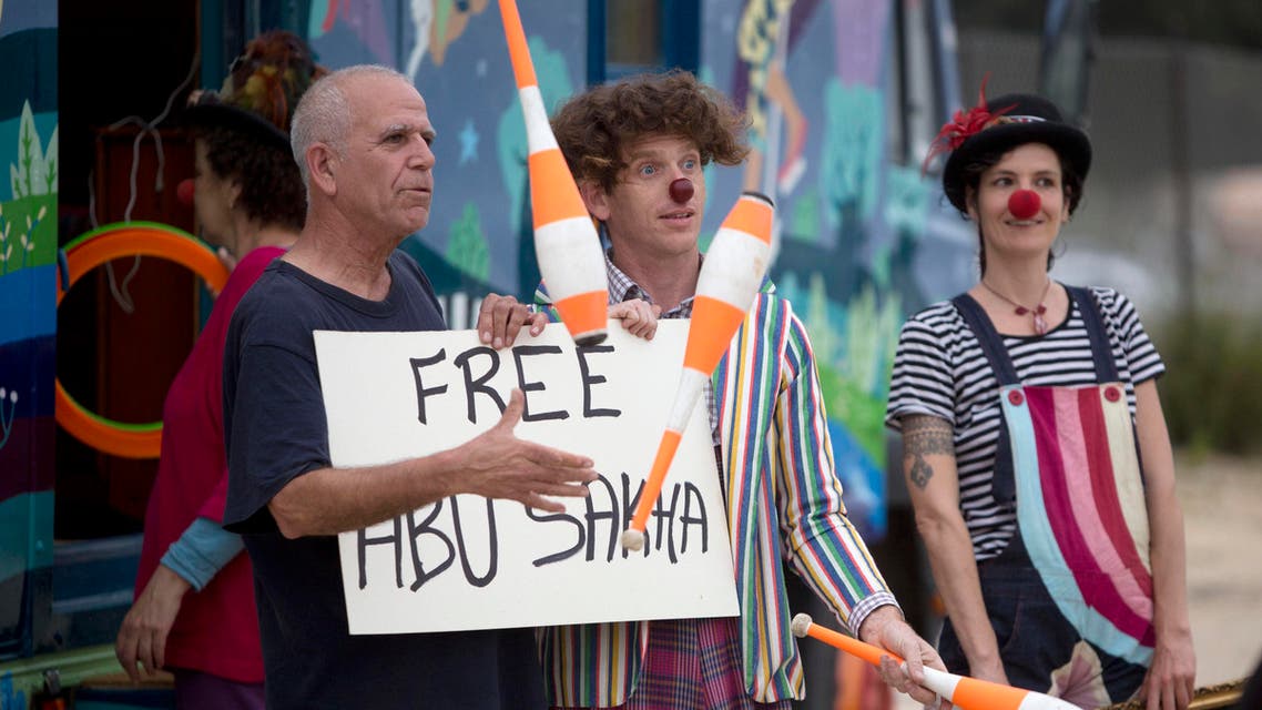 Israeli circus artists protest for the release of Palestinian detainee Abu Sakha, a circus performer on a 6-month administrative detention, outside the Megiddo prison northern Israel, Wednesday, March 2, 2016. (AP)
