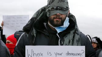 Iranian French camp protesters sew mouths shut