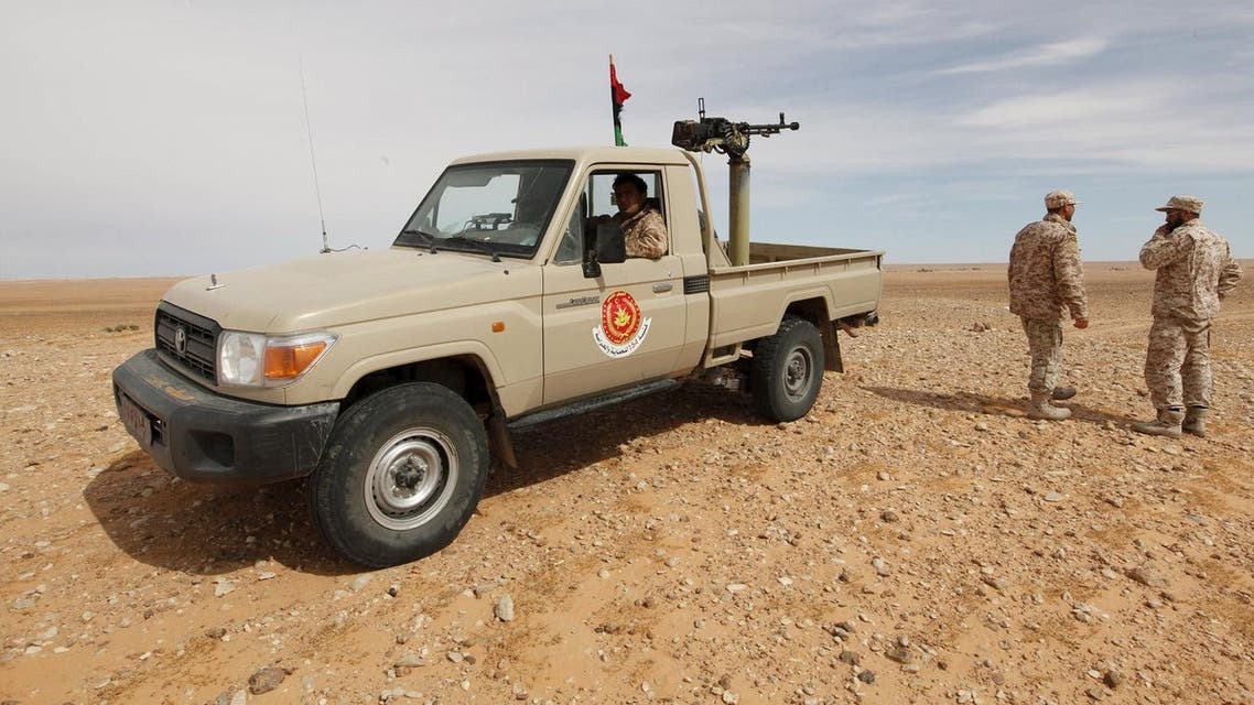 Libyan soldiers stand at a military outpost in Wadi Bey, west of the Islamic State-held city of Sirte, February 23, 2016 REUTERS