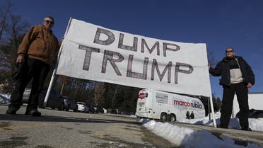 Protesters hold up a "Dump Trump" sign outside of U.S. republican presidential candidate Marco Rubio campaign event in Hudson, New Hampshire. (Reuters)