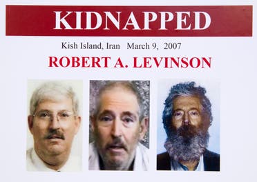 An FBI poster showing a composite image of retired FBI agent Robert Levinson, right, of how he would look like now after five years in captivity, and an image, center, taken from the video, released by his kidnappers, and a picture before he was kidnapped, left, displayed during a news conference in Washington, on March 6, 2012. (File photo: AP)