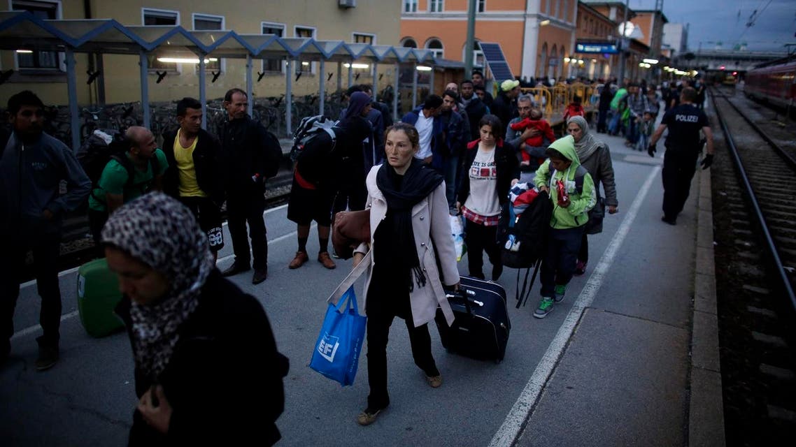 Refugees wait for a train to Munich at the train station of the south German border town Passau, Germany, Tuesday, Sept. 15, 2015. (AP)