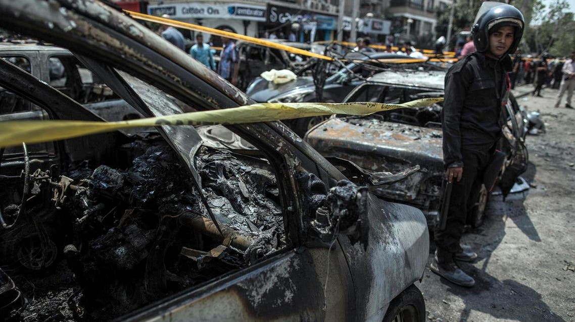In this Monday, June 29, 2015 file photo, an Egyptian policeman stands guard at the site of a car bombing that killed Egypt’s top prosecutor, Hisham Barakat, in Cairo, Egypt. The government is pushing through a new anti-terrorism draft bill that raised complaints that the government is taking advantage of the public's shock over last week's attacks, but it was also hailed by Egypt's political parties and other public figures as a much needed tool to combat violence that has been rising since the military ousted Islamist President Mohammed Morsi two years ago. (AP Photo/Eman Helal, File)