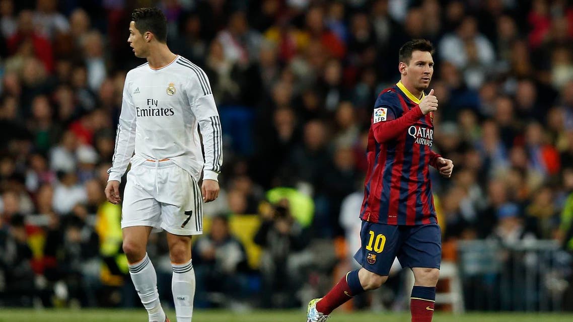Barcelona's Lionel Messi from Argentina, right, celebrates his goal next Real's Cristiano Ronaldo, left, during a Spanish La Liga soccer match between Real Madrid and FC Barcelona at the Santiago Bernabeu stadium in Madrid, Spain, Sunday, March 23, 2014. (AP)