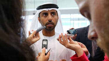 United Arab Emirates Oil Minister Suhail al-Mazroui (C) talks to journalists during the Global Aerospace Summit in Abu Dhabi, on March 7, 2016. / AFP